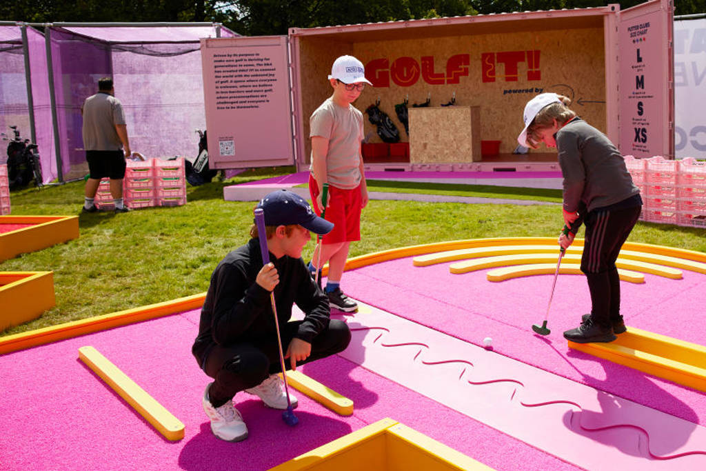 Children have a go at putting in the AIG Women's Open festival fan village